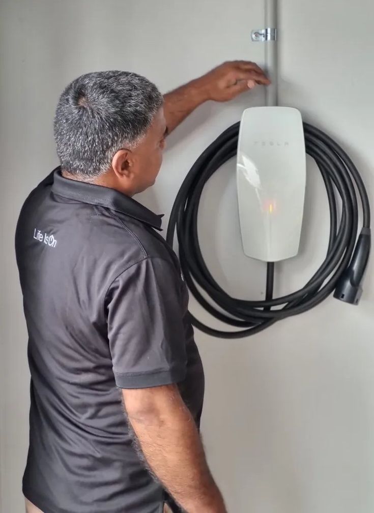 Licensed electrician installing EV charger in GTA home